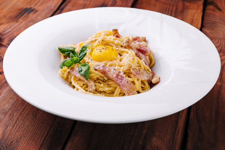 Pasta carbonara with bacon, egg and cheeseの写真素材