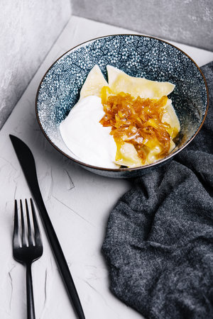 Boiled Vegan dumplings with potatoes with fried onionsの写真素材