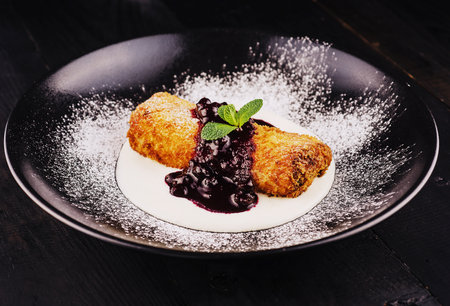 Puff pastry apple strudel with ice cream, served with cherry jamの写真素材