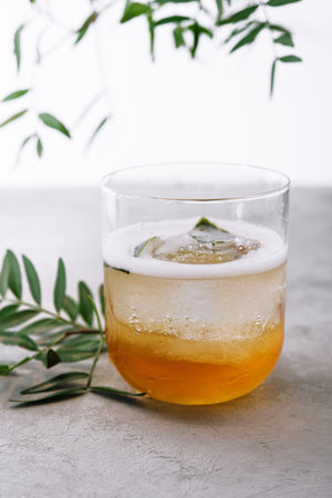 Iced tea in a glass with ice cubes