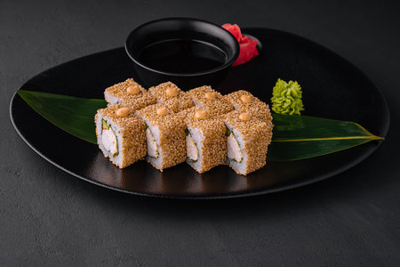 Tasty sushi rolls california with snow crab, cream cheese, avocado with sesame seedsの写真素材
