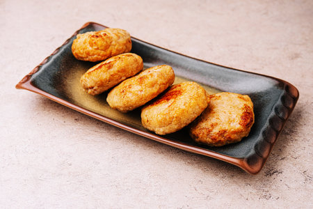 Delicious homemade cutlets in ceramic plate