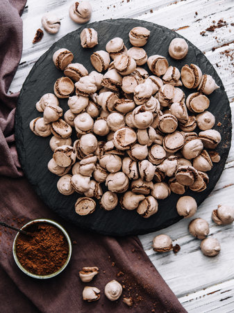 Chocolate meringues scattered on the tableの写真素材