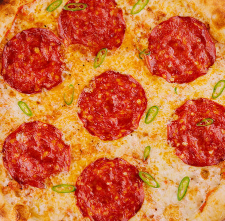 Pepperoni pizza. italian pizza background or textureの写真素材