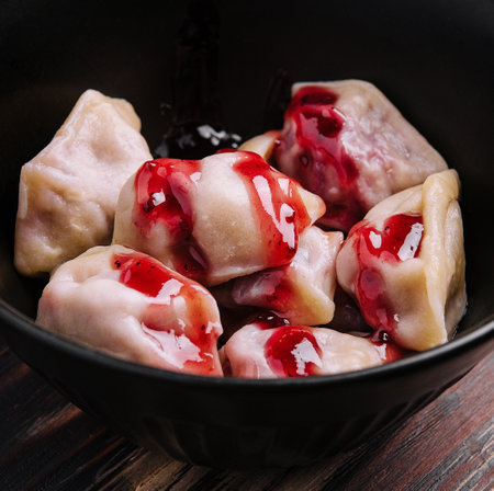 Delicious dumplings with cherries and jamの写真素材