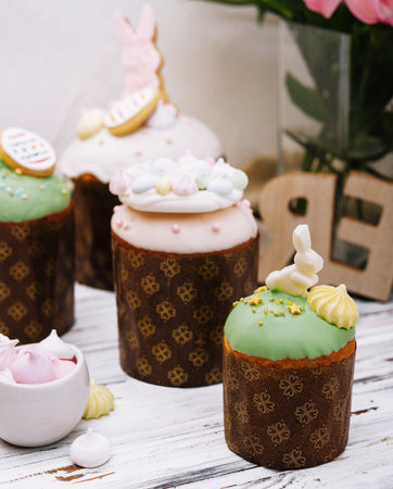 Beautiful easter decoration with meringue, rabbits in pastel colors