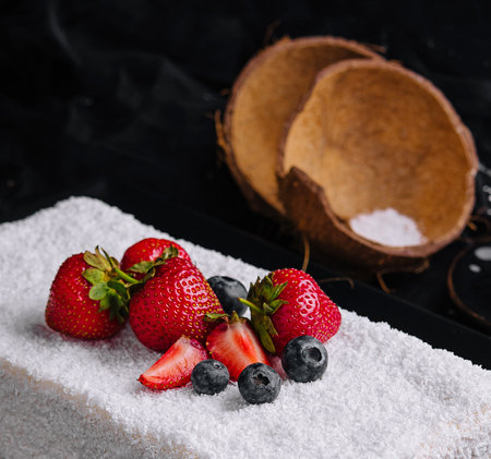 raffaello cake coconut almond cake with berriesの写真素材