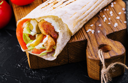 Shawarma rolled in lavash, moist grilled meatの写真素材