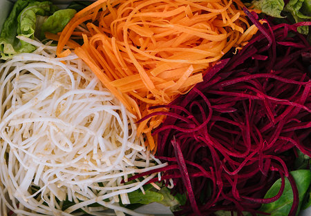 Slice fresh vegetables on the white plateの写真素材