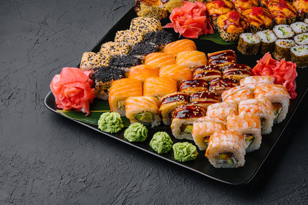 Sushi set on the black plateの写真素材