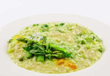 Dish of risotto with asparagus isolated on white planeの写真素材
