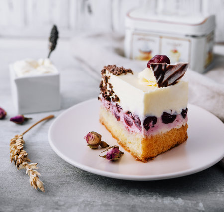 Slice of cherry cheesecake on plateの写真素材