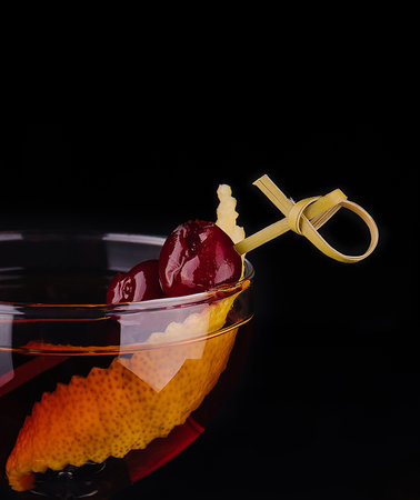 Glass of tasty Negroni cocktail with orange peelの写真素材