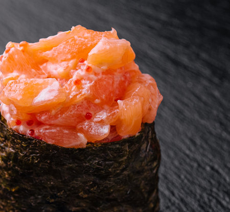 Gunkan with salmon close up on blackの写真素材