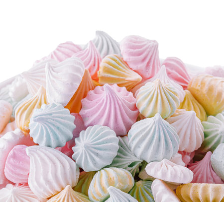 Small colorful meringues close up on whiteの写真素材
