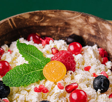 coconut bowl with cottage cheese and ripe berriesの写真素材