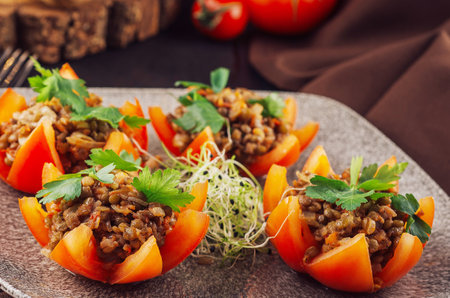 Tasty red stuffed tomatoes with rice and minced meatの写真素材