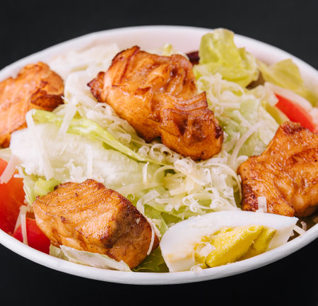 Caesar salad with chicken fillet and parmesan cheeseの写真素材