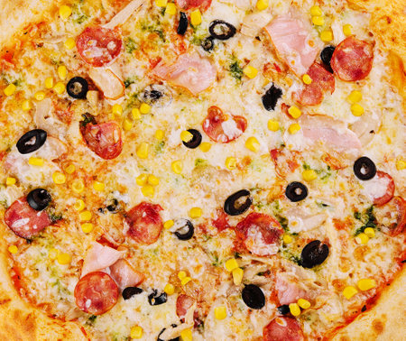 tasty pizza close up background or textureの写真素材