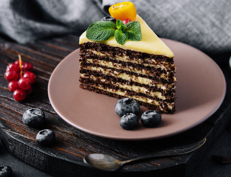 chocolate vanilla cake with berries on plateの写真素材