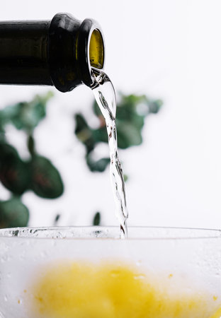 Pouring champagne or prosecco into a glassの写真素材
