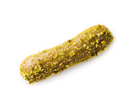 Sweet eclairs with dry pistachios isolated
