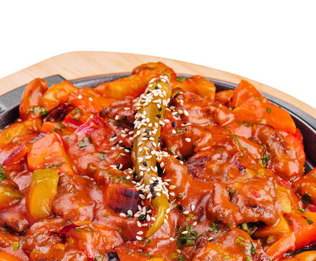 pan with vegetable stew on wooden board