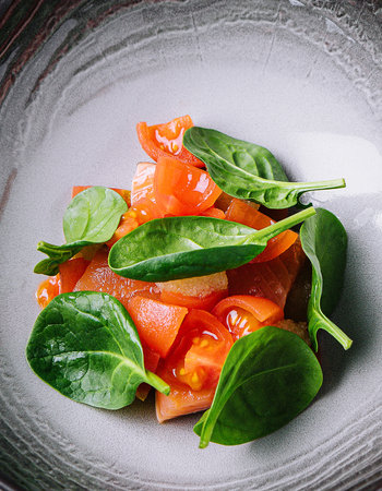 tomato and basil salad on top viewの写真素材