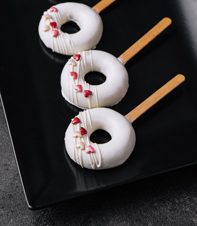 Lolipops mousse on a black plateの写真素材