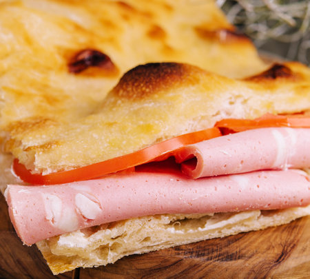 Fried pita bread with ham close upの写真素材