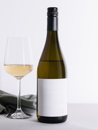 Bottle and glass of white wine isolated on white backgroundの写真素材