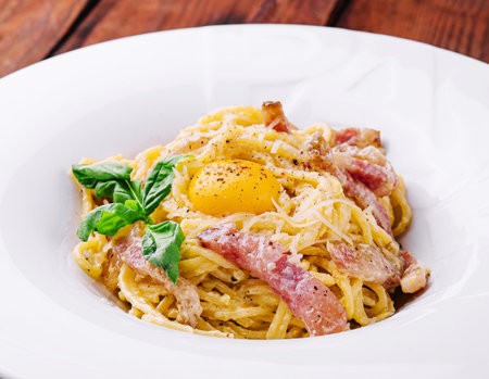 Pasta carbonara with bacon, egg and cheeseの写真素材