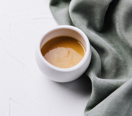 honey mustard sauce in a ceramic jarの写真素材