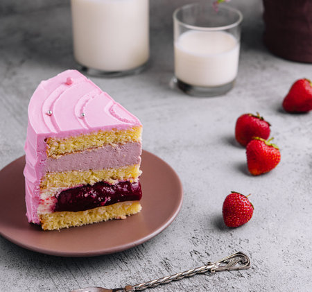 slice of pink cake with milkの写真素材