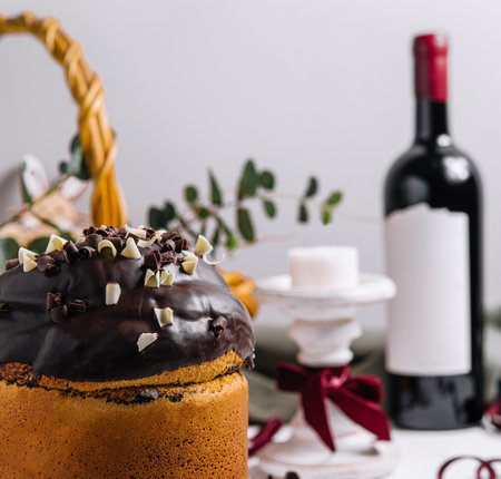 Easter cakes with colored eggs on a wooden tableの写真素材