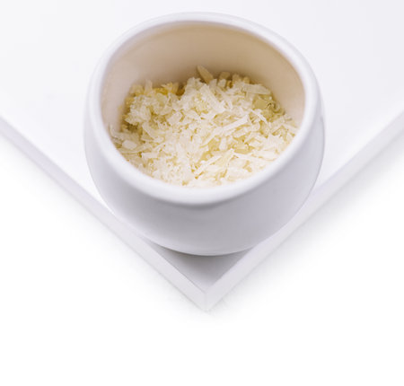 grated parmesan cheese in ceramic bowlの写真素材