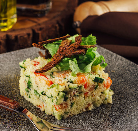 Couscous with vegetables served in plateの写真素材