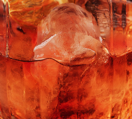 Dark orange drink in glass close upの写真素材