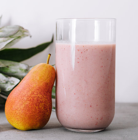 Smoothies of pear, pineapple and raspberries with yogurtの写真素材
