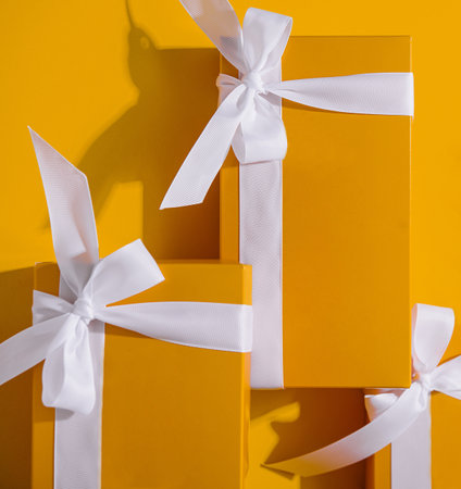 Yellow gifts on a yellow background