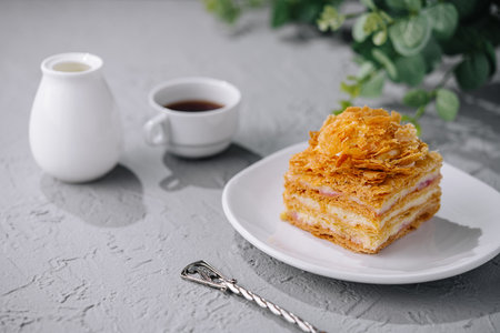 Napoleon cake slices with cup of coffee