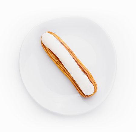 Dessert Eclair with whipped cream and sugar icingの写真素材