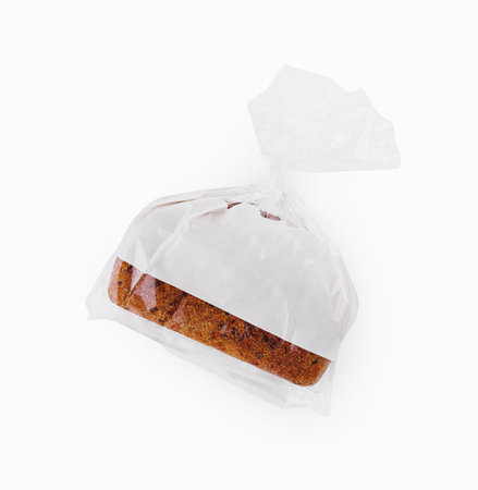 Loaf of wheat bread in plastic bag isolatedの写真素材
