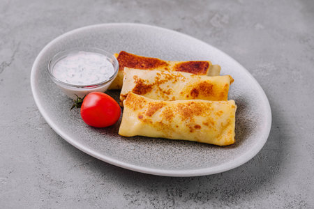thin pancakes on plate top view
