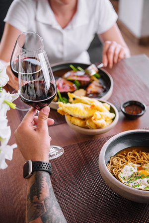 Man and woman drinking red wine in the restaurant