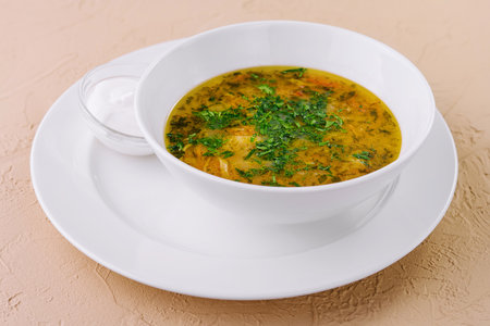 parsley noodle soup on white bowlの写真素材