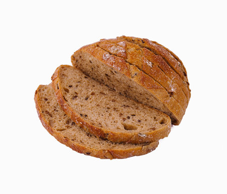 Flat-lay of freshly baked sourdough bread loaf and bread slices