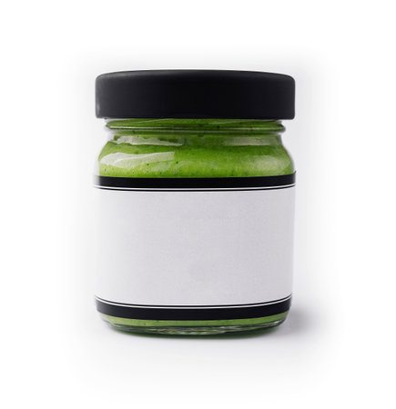 Pesto sauce in a glass jar isolatedの写真素材