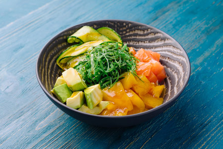 poke bowl with salmon on wood