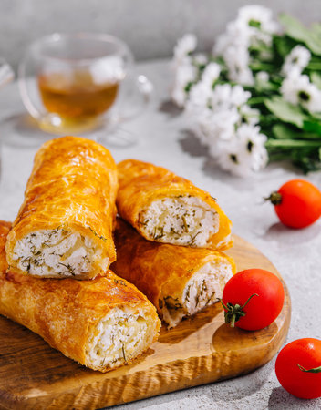 Cooking traditional pies with cottage cheese on wooden tableの写真素材